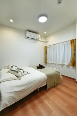 a bedroom with a bed and a window at BSY201 Ueno Shouzoku 201, 3 mins walk from the station, rare listing in Ueno business district! Great value listing in Tokyo