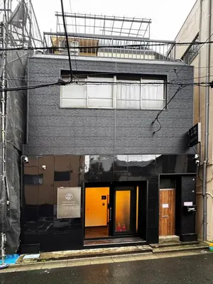 a building with an orange door on the side of it at BSY201 Ueno Shouzoku 201, 3 mins walk from the station, rare listing in Ueno business district! Great value listing in Tokyo