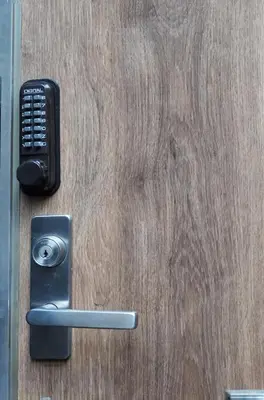 a door with a cell phone and a handle at BSY202 Ueno Kozuki 202, 3 mins walk to subway station, rare listing, Ueno walking business district, cost-effective in Tokyo