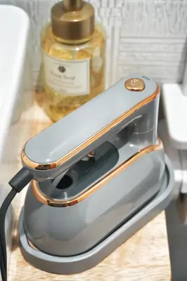 a close up of a cell phone in a holder at BSY301 Ueno Xiao Zhu 301, 3 mins to subway station, rare listing, quality homestay, Ueno hiking business district! in Tokyo