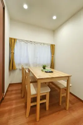 a dining room with a wooden table and chairs at BSY301 Ueno Xiao Zhu 301, 3 mins to subway station, rare listing, quality homestay, Ueno hiking business district! in Tokyo