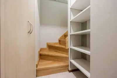 a walk in closet with wooden stairs at \u30f4\u30a3\u30f3\u30c6\u30fc\u30b8CiTY\u62bc\u4e0a in Tokyo