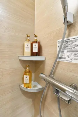 two bottles of soap on shelves on a wall at BSY302 Ueno Kozuki 302, walk to Ueno shopping district, 3 min walk to subway station, rare quality listing! High-speed 10G Wi-Fi in Tokyo