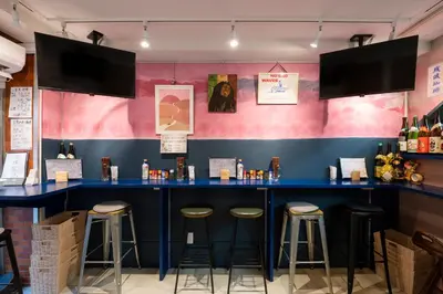 a blue bar with stools in a restaurant at Pagi Hotel in Tokyo
