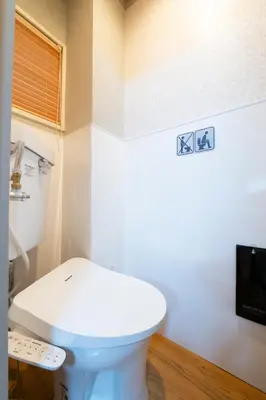 a bathroom with a white toilet in a room at Pagi Hotel in Tokyo