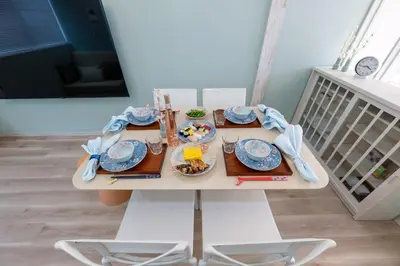 a table with plates of food on it at 長期割がお得 最大8名 2BR 55平米 東京駅電車10分 TDR スカイツリー好アクセス 駐車場予約 送迎有 HOTEL DREAM MUSIC Tōyōchō pastel in Tokyo