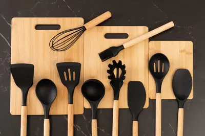 a wooden cutting board with utensils and a whisk at Skytree Tokyo Apartment Ohanachaya in Tokyo