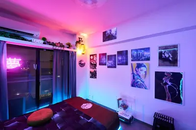 a room with a bed with purple lights on it at Cyber Shinjyuku Tokyo Room in Tokyo