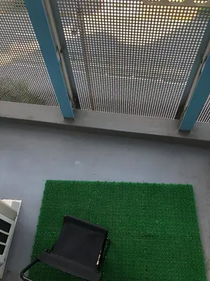 a black briefcase sitting on a green carpet at Cyber Shinjyuku Tokyo Room in Tokyo