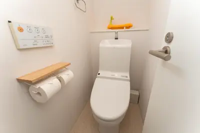a bathroom with a white toilet in a room at Skytree Tokyo Residence Aoto in Tokyo