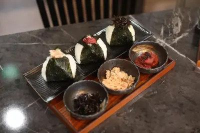 a plate of food with sushi on a table at 長期ステイ歓迎 ポップ ディズニー風 TDR スカイツリー好アクセス 定員3名 東京駅10分 駐車場予約 送迎有 HOTEL DREAM MUSIC Tōyōchō japanese-pop in Tokyo