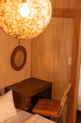 a room with a desk and a chair and a mirror at Skytree Tokyo House Takasago in Tokyo