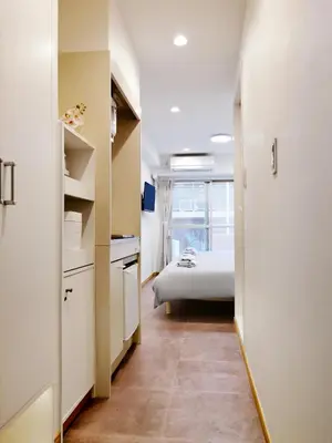 a small room with a bed and a bedroom at Fukuda House Shinjuku in Tokyo
