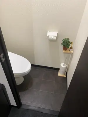 a bathroom with a toilet and a potted plant at New Up to 10 people OK! 30-second walk from the station exit! Superhosts are here to help you in a polite and prompt manner! Rest assured stay! in Tokyo