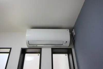 a television in a room with three windows at New Up to 10 people OK! 30-second walk from the station exit! Superhosts are here to help you in a polite and prompt manner! Rest assured stay! in Tokyo