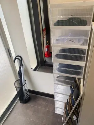 a closet with an umbrella and an open door at New Up to 10 people OK! 30-second walk from the station exit! Superhosts are here to help you in a polite and prompt manner! Rest assured stay! in Tokyo
