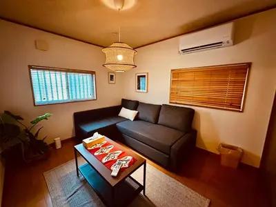 a living room with a couch and a table at ViVo\u9280\u5ea7 in Tokyo