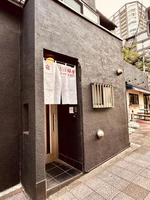 a door to a building with signs on it at ViVo\u9280\u5ea7 in Tokyo
