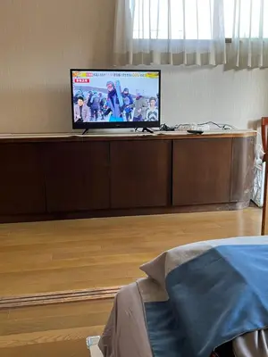 a flat screen tv sitting on top of a table at Japan Harry Potter Guesthouse in Tokyo