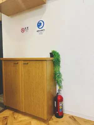 a fire hydrant sitting next to a fire extinguisher at 4min to \u6771\u65b0\u5bbfShinjuku in Tokyo