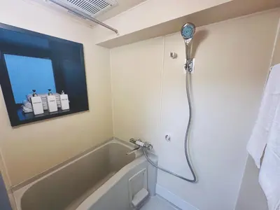 a bathroom with a shower with a tub at 4min to \u6771\u65b0\u5bbfShinjuku in Tokyo