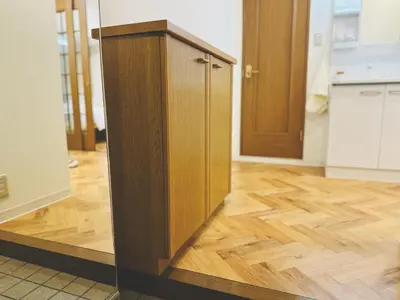 a wooden cabinet in a kitchen with a wooden floor at 4min to \u6771\u65b0\u5bbfShinjuku in Tokyo