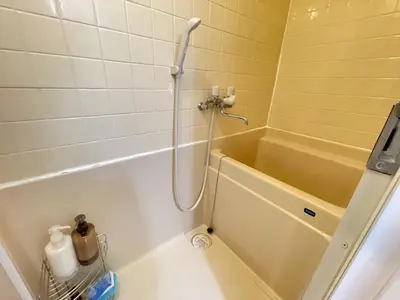 a shower in a bathroom with a bath tub at Shibuya myroom in Tokyo