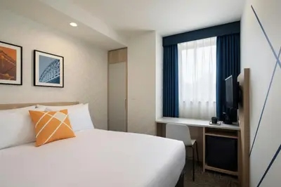 a hotel room with a bed and a desk at Four Points Flex by Sheraton Tokyo Higashi Kanda in Tokyo
