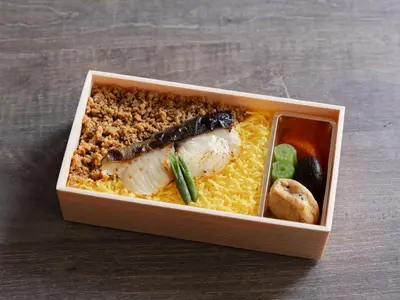 a box of food with meat and rice and vegetables at Four Points Flex by Sheraton Tokyo Higashi Kanda in Tokyo