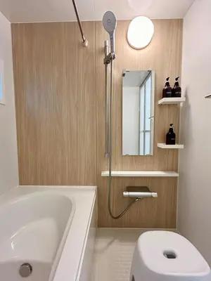 a bathroom with a tub and a toilet and a sink at Shinjuku Area 3 Bedroom House in Tokyo