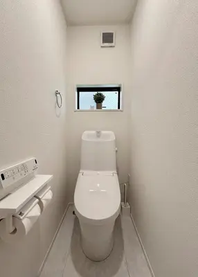 a small bathroom with a toilet and a window at Shinjuku Area 3 Bedroom House in Tokyo