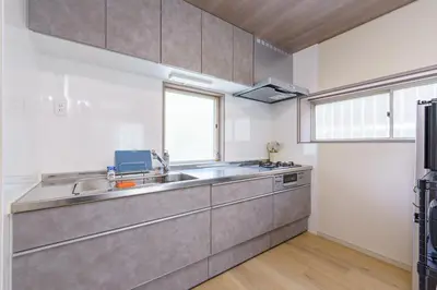 a kitchen with a sink and a window at Enjoy Meguro House in Tokyo