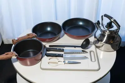 three pots and utensils on a white table at \u30a8\u30d3\u30b9\u30d3\u30eb8\u968eStayCreek in Tokyo