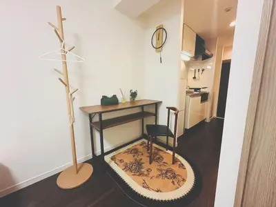 a room with a desk and a chair and a table at Shinjuku city\u897f\u65b0\u5bbf in Tokyo