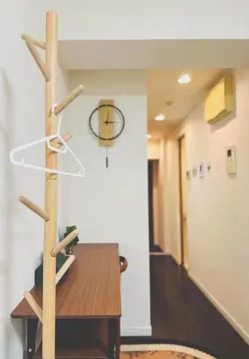 a hallway with a table and a basketball hoop on the wall at Shinjuku city\u897f\u65b0\u5bbf in Tokyo