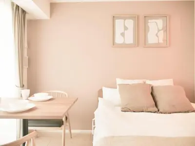 a living room with a white couch and a table at Triphome Sugamo Otsuka 2025 New 7 mins 2 stations in Tokyo