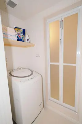 a washer and dryer in a laundry room at Taito City Negishi 2Ldk-TT0323 in Tokyo