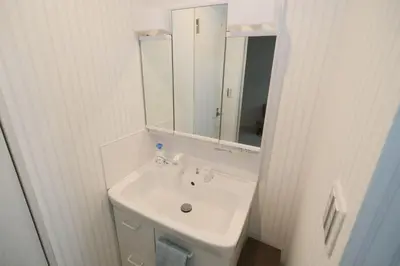 a white bathroom with a sink and a mirror at Taito City Negishi 2Ldk-TT0323 in Tokyo