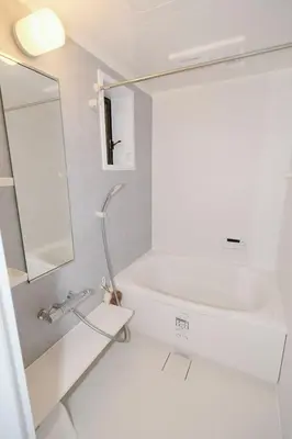 a white bathroom with a tub and a sink at Taito City Negishi 2Ldk-TT0323 in Tokyo