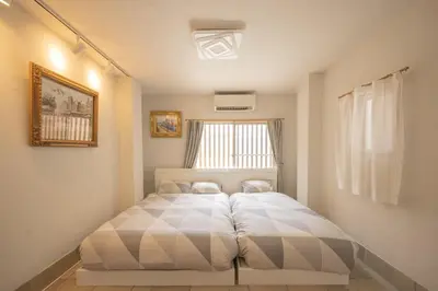 a bedroom with a large bed in a room at Ryokan ○ - Vacation STAY 01019v in Tokyo