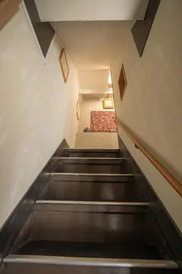 an escalator leading up to a staircase in a building at Ryokan ○ - Vacation STAY 01019v in Tokyo