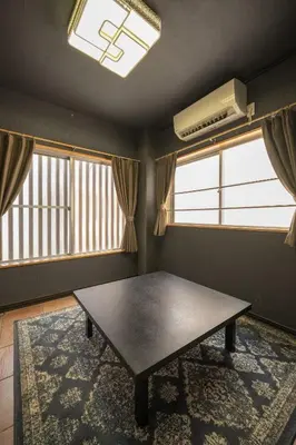 a dining room with a table and two windows at Ryokan ○ - Vacation STAY 01019v in Tokyo
