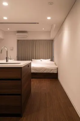 a bathroom with a sink and a bed in a room at Cava House - Vacation STAY 07286v in Tokyo