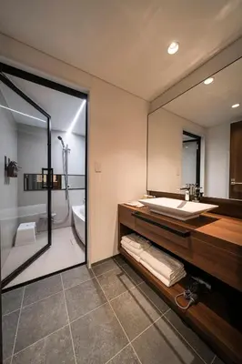 a bathroom with a sink and a mirror at Cava House - Vacation STAY 07286v in Tokyo