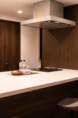 a kitchen with a counter with a plate of food at Cava House - Vacation STAY 07286v in Tokyo