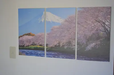 three paintings of a mountain on a wall at Takaoka Building - Vacation STAY 10286v in Tokyo