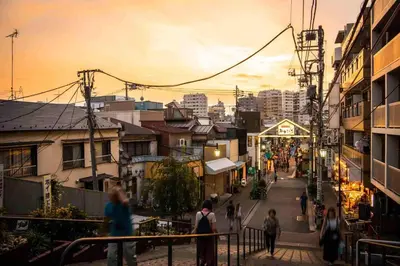 a group of people walking down a city street at Takaoka Building - Vacation STAY 10286v in Tokyo