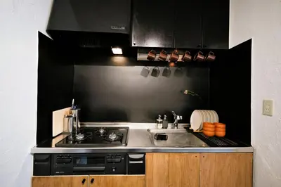 a kitchen with a sink and a stove at Eden House - Vacation STAY 19890 in Tokyo