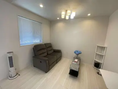 a living room with a chair and a window at Nerima-ku - House - Vacation STAY 19929 in Tokyo
