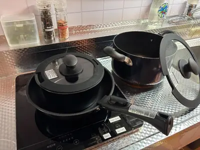 a pot sitting on top of a stove in a kitchen at Shinjuku Camellia Nest in Tokyo